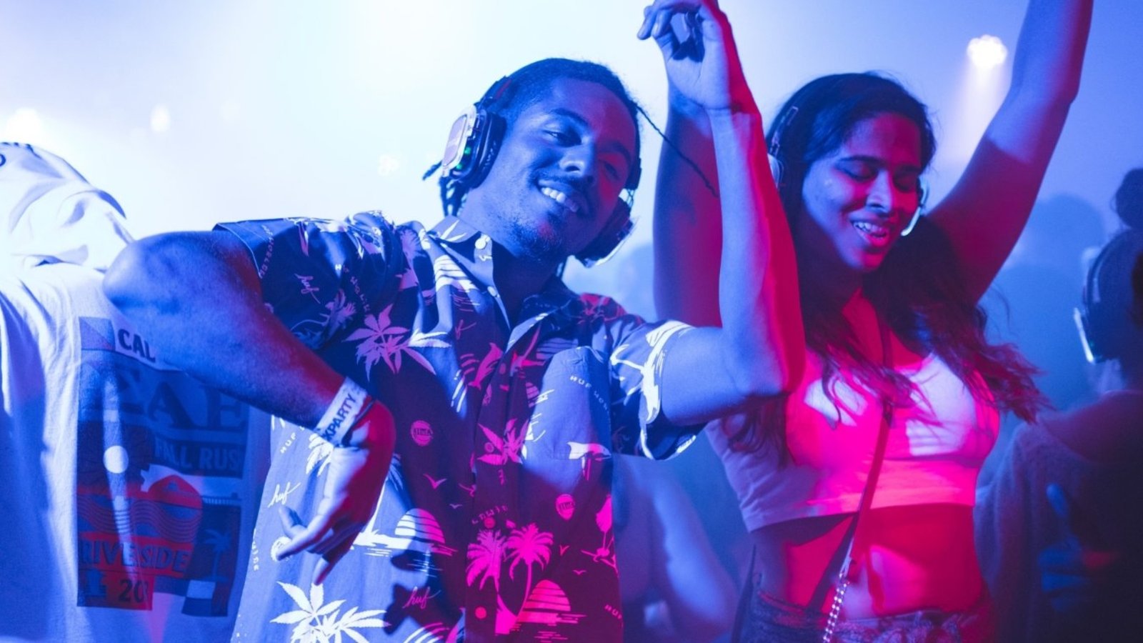 demo-attachment-34-smiling-man-standing-and-dancing-near-smiling-woman-2240771