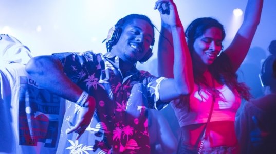 demo-attachment-34-smiling-man-standing-and-dancing-near-smiling-woman-2240771